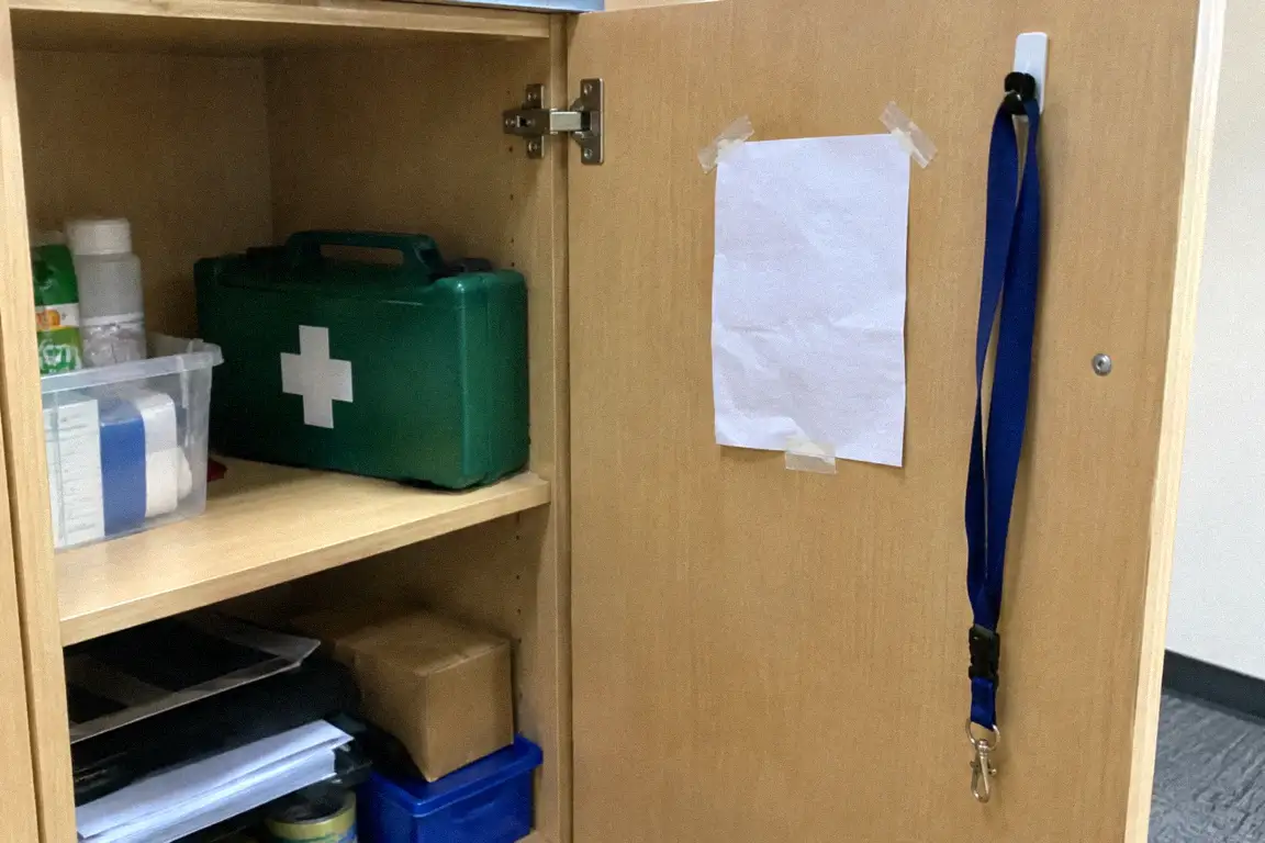 a short handwritten restore note taped inside a cupboard door